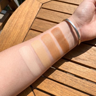 Three depths of tan built from different counts of Oleyra Tanning Drops