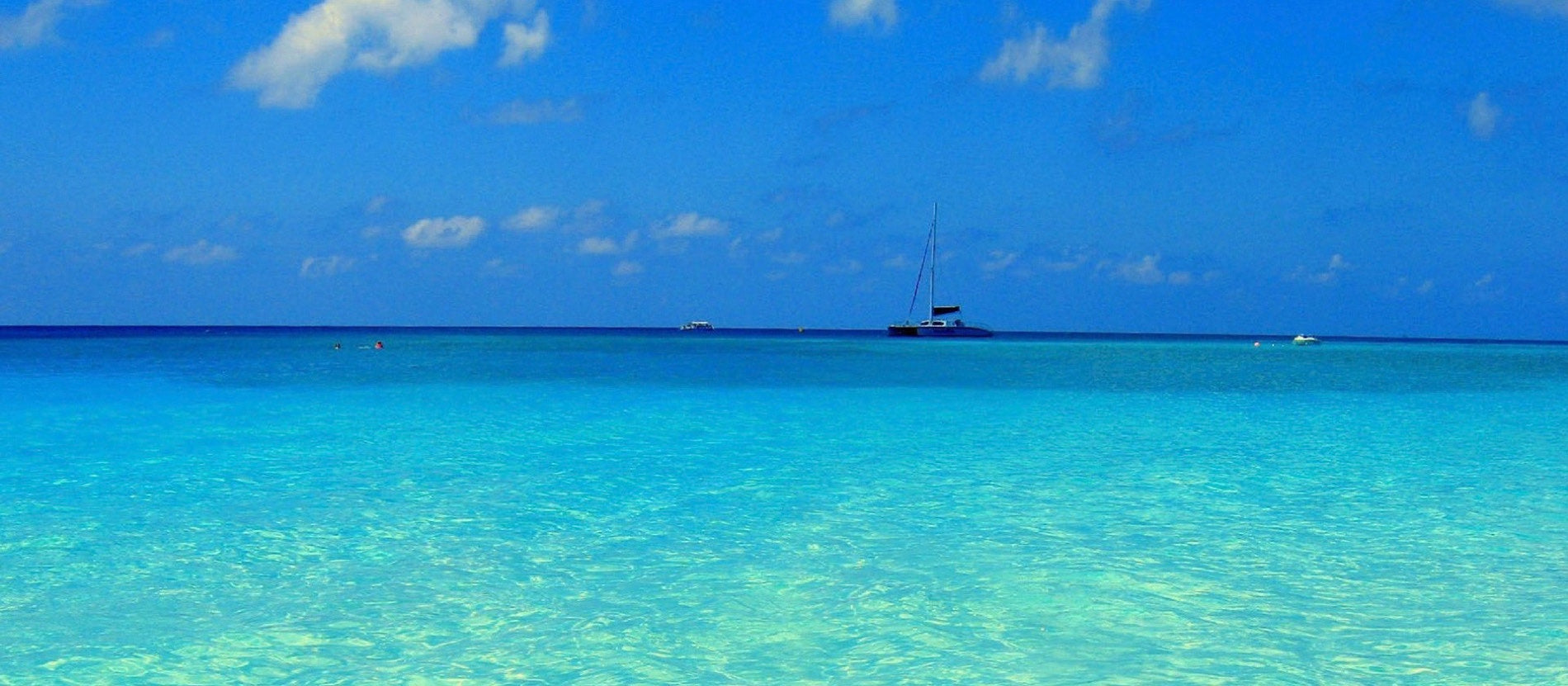 Clear shallow sea under an open sky