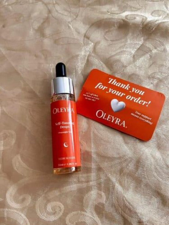 Customer photo of Oleyra tanning drops with an order card