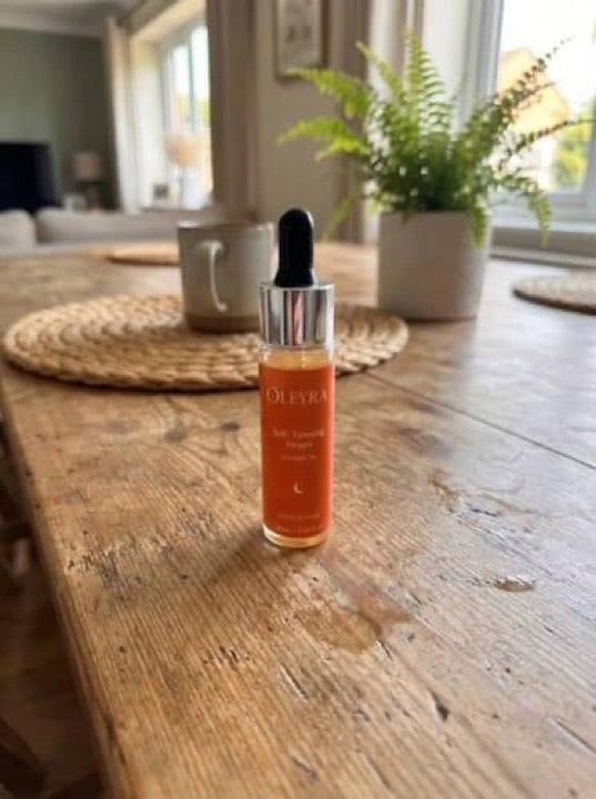Customer photo of an Oleyra tanning drops bottle on a table